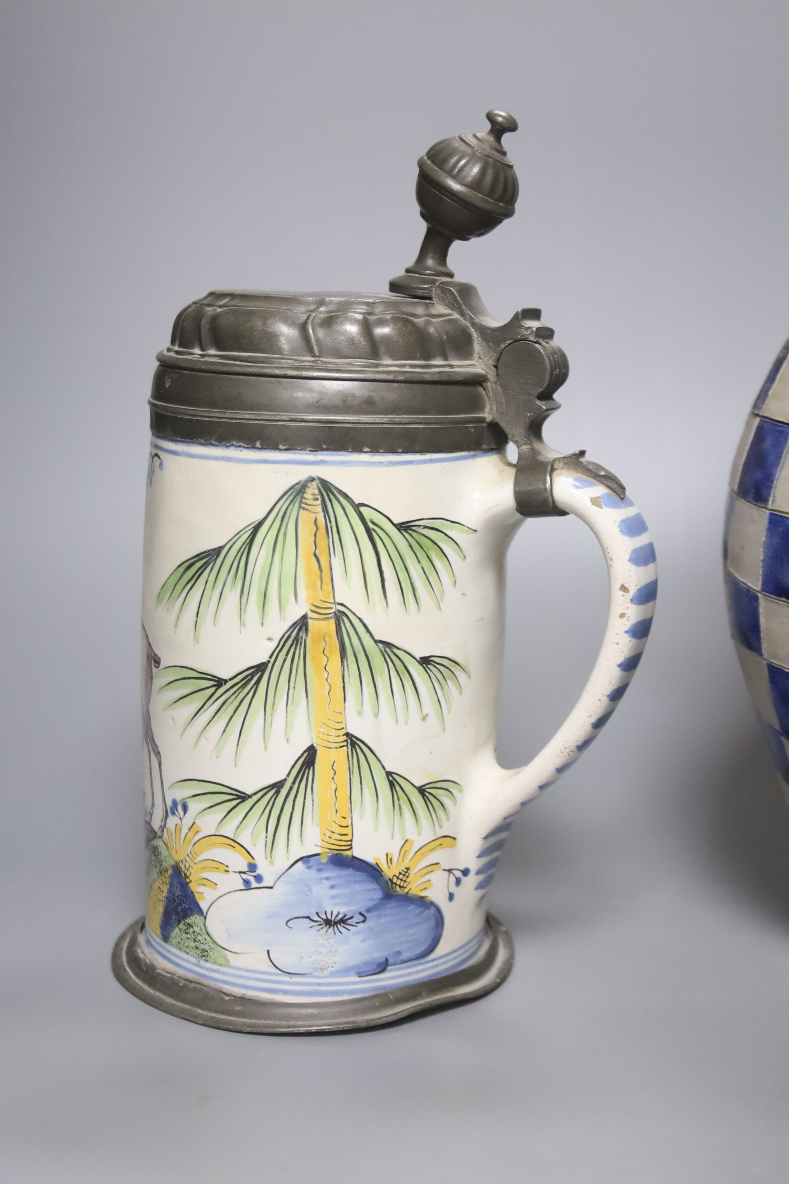 An 18th/19th century German faience pewter-mounted stein decorated with a stag and a German stoneware pitcher, height 25cm & 30cm
